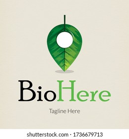 A tree leaf forming a locating pin. Logo