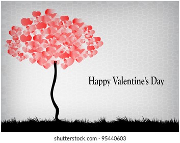 A tree with leaves heart shaped standing on meadow