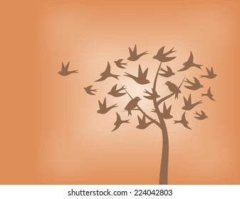Tree made of swallow birds in shades of orange