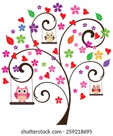 tree with owls swinging and flowers