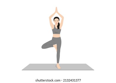 Tree Pose, Vrksasana, Vriksasana,. Beautiful girl practice Vrikshasana. Young attractive woman practicing yoga exercise. working out, black wearing sportswear, grey pants and top, indoor full length