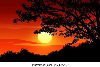 Tree silhouette against red sunset