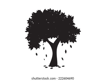 A tree silhouette with the falling leaves