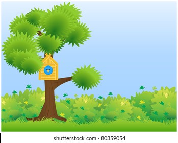 A tree standing on a green meadow with birdhouse and blue bird