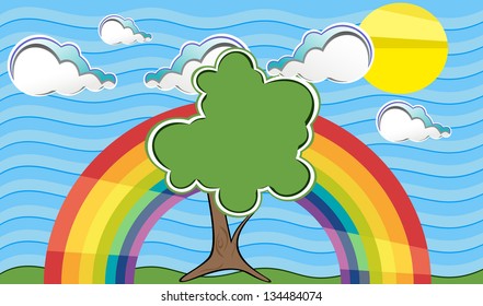 tree in summer, against a blue sky with clouds and a rainbow.