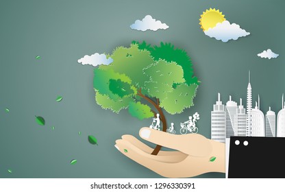 Trees on the hand and the development of the city,World environmental and sustainable development,Save the world with urban landscape concept.Paper art style.