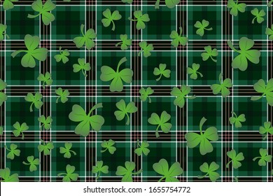 Trefoil on the background of Ireland tartan for St. Patrick's Day decoration 