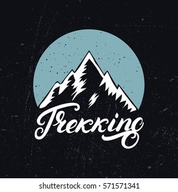 Trekking hand written lettering logo, label, badge, emblem with mountains. Isolated on background. Vector illustration.