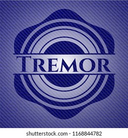 Tremor badge with denim background