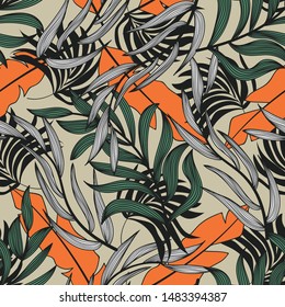 Trend abstract seamless pattern with colorful tropical leaves and plants on beige background. Vector design. Jungle print. Floral background. Printing and textiles. Exotic tropics. Summer.