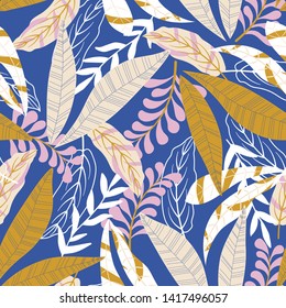 Trend seamless pattern with bright tropical leaves and flowers on purple background. Vector design. Jungle print. Textiles and printing. Floral background.