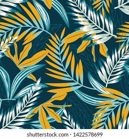 Trend seamless pattern with bright tropical leaves and plants on a dark background. Vector design. Jung print. Floral background. Printing and textiles.