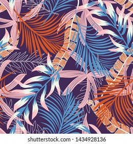 Trend seamless pattern with bright tropical leaves and plants on a blue background. Vector design. Jungle print. Floral background. Printing and textiles. Exotic tropics. Summer design.