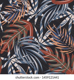 Trend seamless pattern with colorful tropical leaves and plants on a dark background. Vector design. Jungle print. Flowers background. Printing and textiles. Exotic tropics. Fresh design.