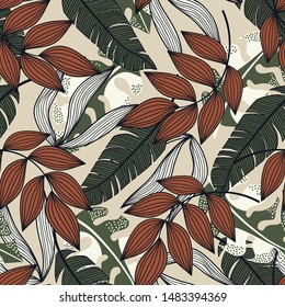 Trend seamless pattern with colorful tropical leaves and plants on beige background. Vector design.Exotic tropics. Summer. Jungle print. Floral background. Printing and textiles. Abstract background.