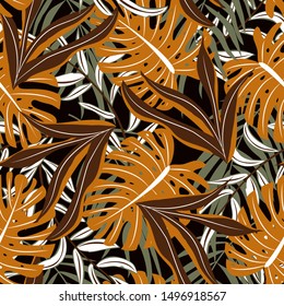 Trend seamless pattern with leaves and plants in yellow tones. Stylish design, textiles, printing. Vector floral seamless pattern. Exotic plants. Trendy pattern. Monstera.
