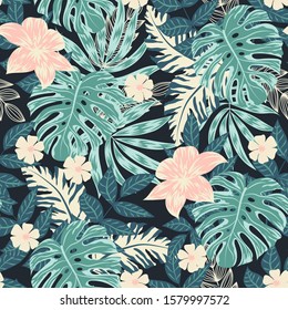 Trend seamless pattern with tropical leaves and flowers on dark background. Floral tropical pattern background with leaves, jungle leaf. Vector background for various surface. Exotic wallpaper.