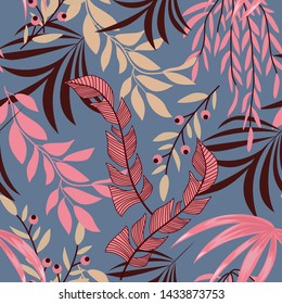 Trend seamless tropical pattern with bright leaves, flowers and plants on blue background. Vector design. Jungle print. Floral background. Printing and textiles. Exotic tropics. Summer design.