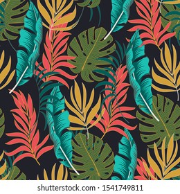 Tendencia tropical sin fisuras con plantas azules y verdes brillantes y hojas en un fondo negro. 
Pieza de jungla sin fisuras vectorial de fondo floral. 
  Diseño de vectores. Impresión de selva. 