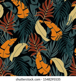 Trend seamless tropical pattern with bright red and yellow plants and leaves on dark background. Tropical botanical. Exotic jungle wallpaper.  Tropic leaves in bright colors.