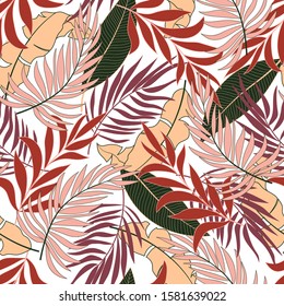 Trend seamless tropical pattern with bright red and yellow plants and leaves on a delicate background. Vintage pattern. Exotic tropics. Summer.  
Vector design. Jungle print. Floral background. 