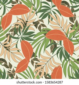 Trend seamless tropical pattern with bright orange and green plants and leaves on beige background. Exotic wallpaper. Trendy summer Hawaii print.