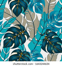 Trend seamless tropical pattern with bright blue plants and leaves on a white background. 
Beautiful exotic plants.  Printing and textiles.  Vector design. Jungle print. Floral background. 