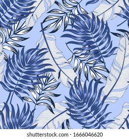 Trend seamless tropical pattern with bright plants and leaves on a purple background.Exotic jungle wallpaper. Seamless pattern with colorful leaves and plants.