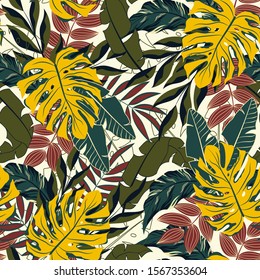 Trend tropical pattern with colorful plants and leaves. Summer background with exotic leaves. Beautiful seamless vector floral pattern. Exotic wallpaper, Hawaiian style. Seamless vector texture.