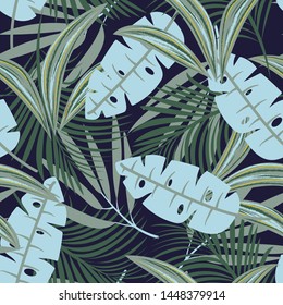 Trending abstract seamless pattern with colorful tropical leaves and plants on blue background. Vector design. Jungle print. Floral background. Printing and textiles. Exotic tropics. Fresh design.