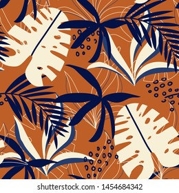 Trending abstract seamless pattern with colorful tropical leaves and plants on orange background. Vector design. Jungle print. Flowers background. Printing and textiles. Exotic tropics. Fresh design.