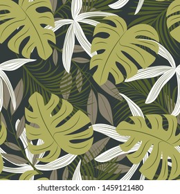 Trending abstract seamless pattern with colorful tropical leaves and plants on green background. Vector design. Jungle print. Flowers background. Printing and textiles. Exotic tropics. Fresh design.