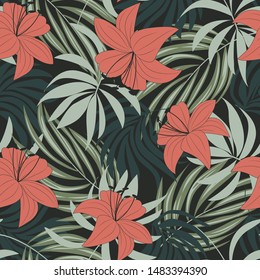 Trending abstract seamless pattern with colorful tropical leaves and flowers on green background. Vector design. Jungle print. Floral background. Printing and textiles. Exotic tropics. Summer.