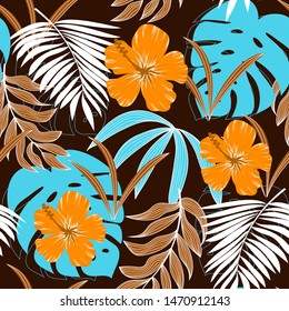 Trending abstract seamless pattern with tropical leaves and bright colors on blue background. Jungle seal. Vector design. The background floral. Textiles and printing. Exotic, tropical.