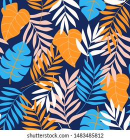 Trending abstract seamless pattern with tropical leaves and bright colors on blue background. Print of the jungle. Vector design. On a floral background. Textiles and printing. Exotic, tropical.