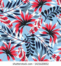 Trending abstract tropical seamless pattern with bright leaves and plants on a light blue background. Vector design. Jungle print. Floral background. Printing and textiles.