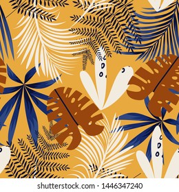 Trending bright seamless background with colorful tropical leaves and plants on yellow background. Vector design. Jungle print. Floral background. Printing and textiles. Exotic tropics. Fresh design.
