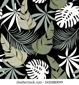 Trending bright seamless pattern with colorful tropical leaves and plants on black background. Vector design. Jungle print. Floral background. Printing and textiles. Exotic tropics. Summer design.
