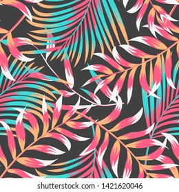 A trending summer tropical seamless pattern with leaves and plants on a brown background. Vector design. Jungle print. Floral background. Printing and textiles.
