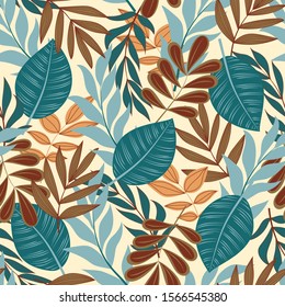 Trendy abstract seamless pattern with tropical leaves and bright flowers on a beige background. Print of the jungle. Vector design. On a floral background. Textiles and printing. Exotic, tropical.