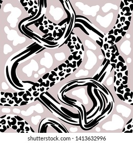 Trendy animal pattern with ornated bands. Seamless vector pattern with leopard spots and snake texture. Safari textile collection. Black, white, beige.