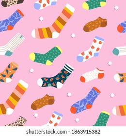 La moda de Navidad calcetines a la perfección patrón sin fisuras. Calcetines dibujados a mano con fondo rosado. Variedad de medias divertidas. Ilustración moderna para papel de papelería, web, textil, papel envolvente