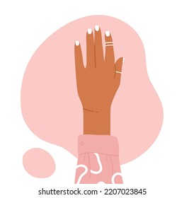 Trendy female manicured hand with stylish rings. Beauty treatment, manicure aesthetics. Vector illustration in cartoon style. Isolated white background	
