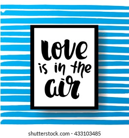 trendy hand lettering poster. Hand drawn calligraphy. Template post card. concept handwritten motivation poster on blue lines "love is in the air"  creative graphic