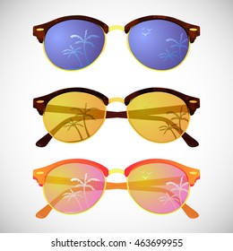 Trendy hipster sunglasses with colorful lens and frame reflect summer palms