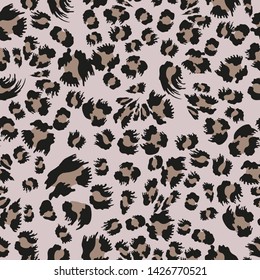 Trendy leopard print. Seamless vector pattern with jaguar spots.  Safari textile collection. On beige background.