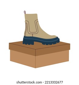 Trendy light brown chelsea boots on the box. Modern stylish casual footwear. Hand drawn vector illustration isolated on white background. Modern flat cartoon style.