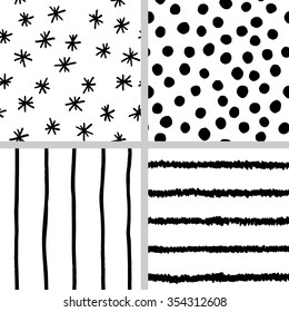 Trendy monochrome seamless patterns. Hipster backgrounds set. Black and white hand drawn polka dot, stripes and snowflakes patterns.