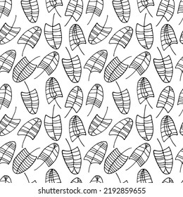 Trendy ornament with leaves tropic plant. Vector seamless pattern  exotic leaves . Black brush leaves.  Black ink texture with foliage. Abstract plant motif
