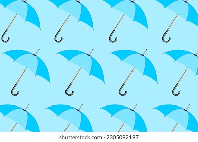 Trendy pattern with umbrellas. A set of modern blue umbrellas on a pastel blue background